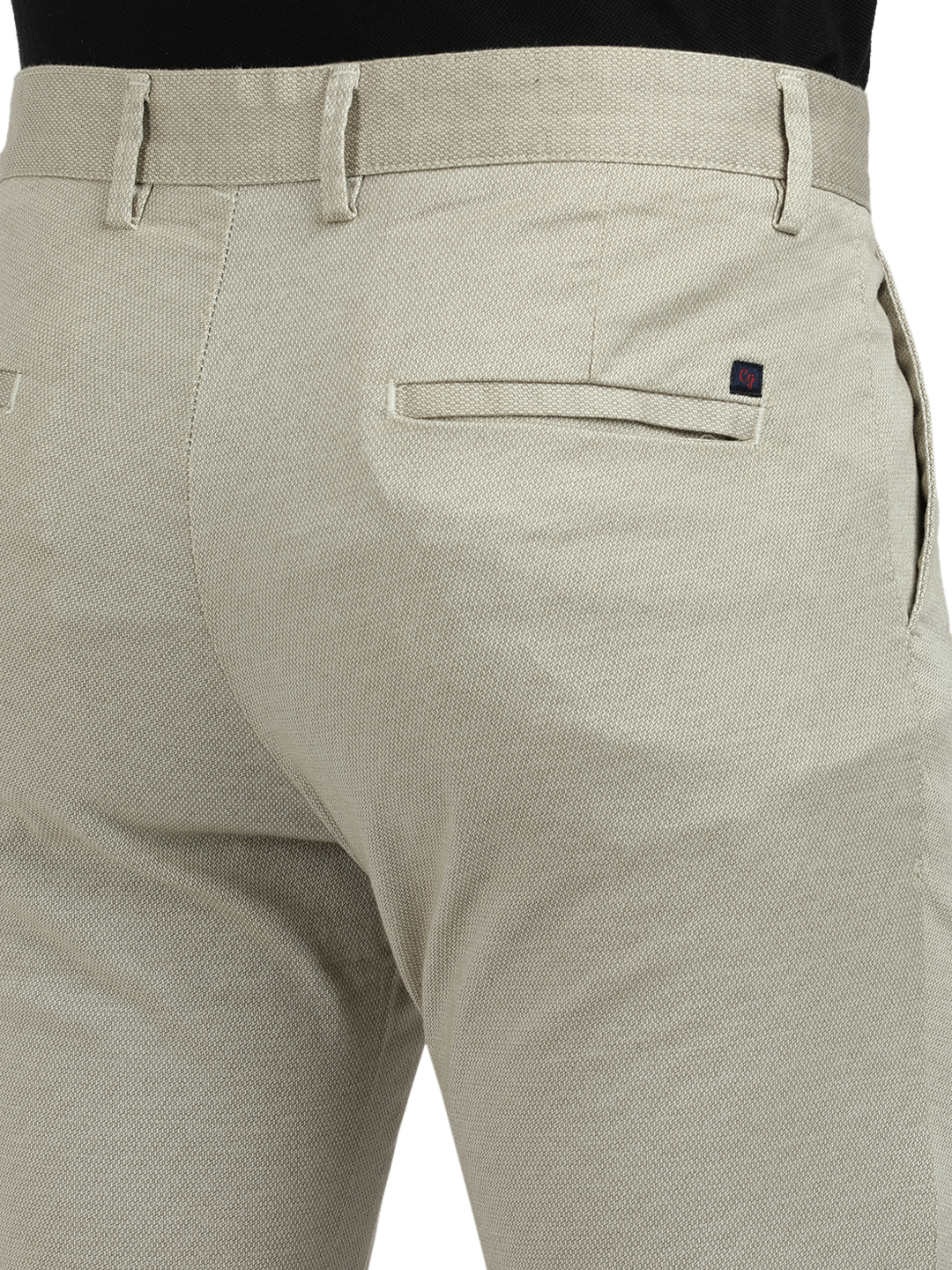 Model wearing Clarke Gable's Beige Custom Fit Trousers in a casual setting