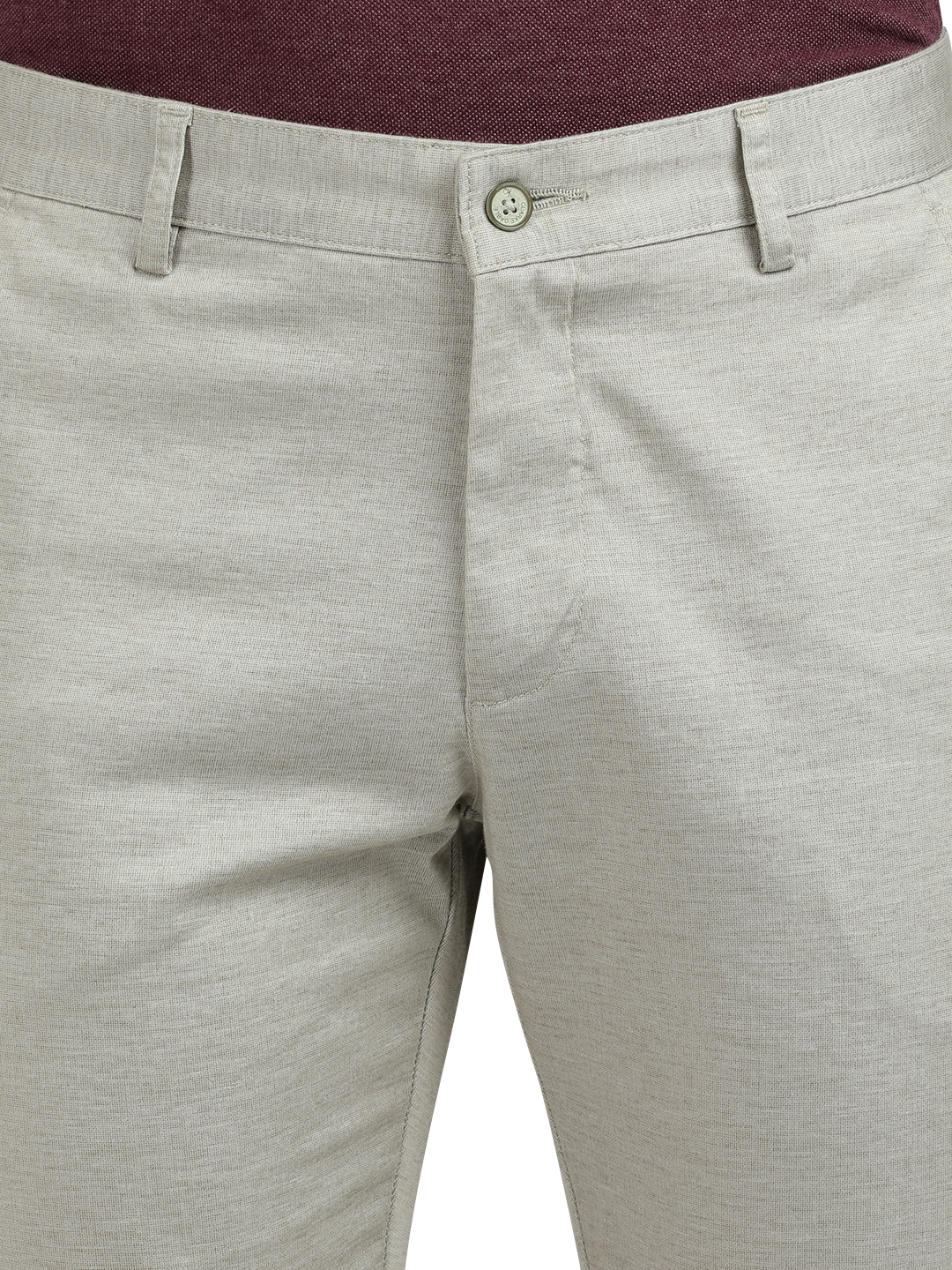 Model wearing Clarke Gable's Cream Custom Fit Trousers in a casual setting