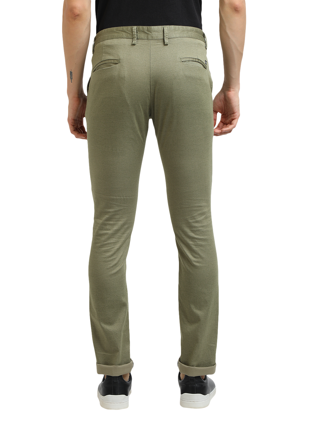 Model wearing Clarke Gable's Mint Trim Fit Trousers in a casual setting