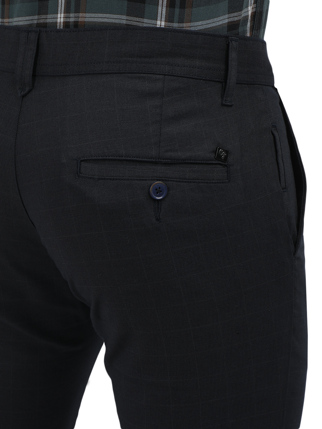 Model wearing Clarke Gable's Navy Trim Fit Trousers in a casual setting