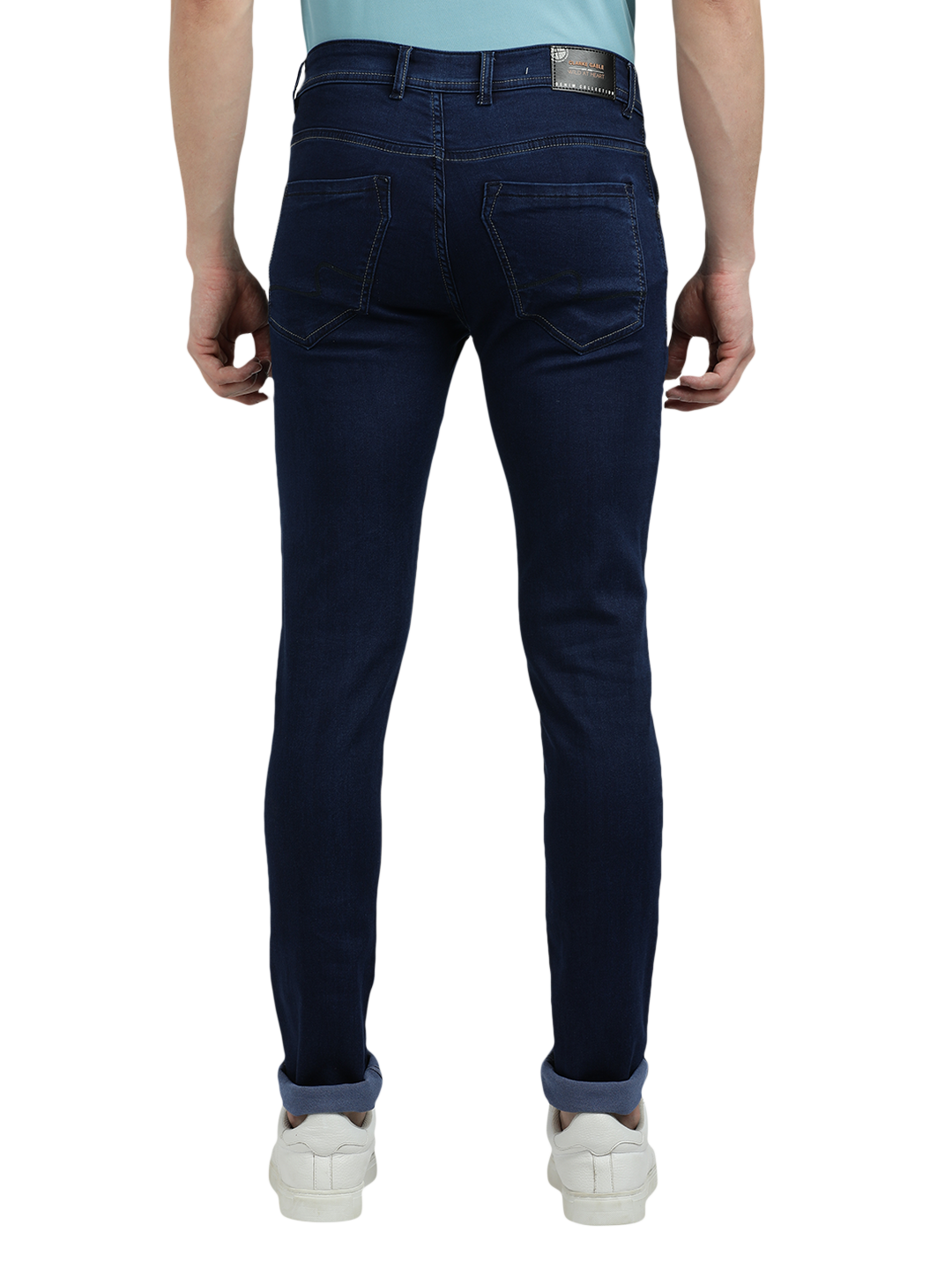 Model wearing Clarke Gable's Solid Dark Blue Skinny Fit Jeans in a casual setting