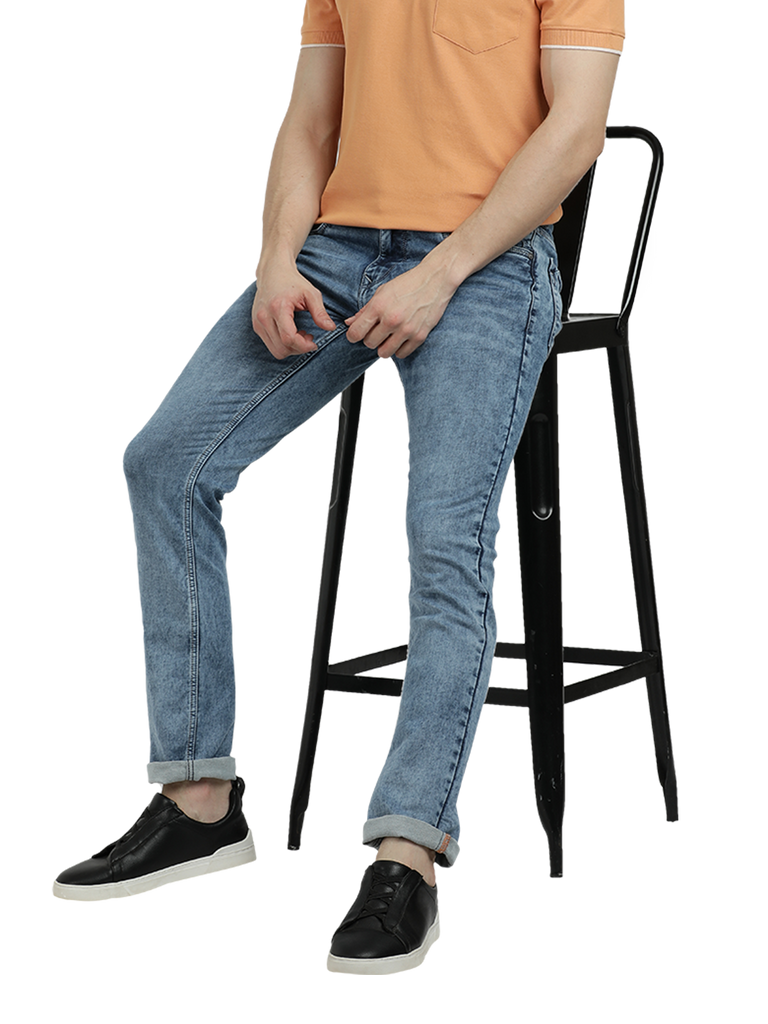 Model wearing Clarke Gable's Aqua Blue Faded Skinny Fit Jeans in a casual setting