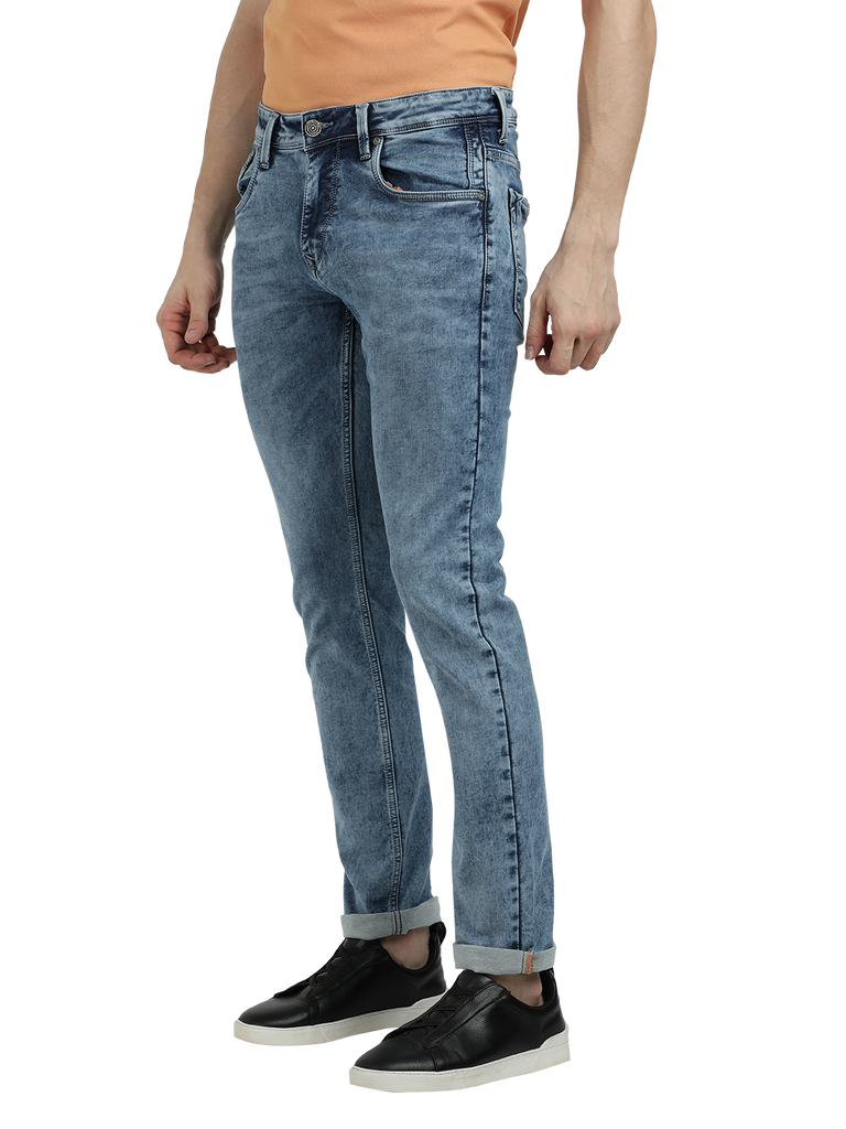 Model wearing Clarke Gable's Aqua Blue Faded Skinny Fit Jeans in a casual setting