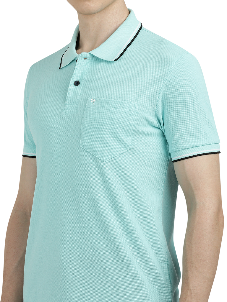 Model wearing Clarke Gable's Aqua Blue Solid Polo Collar T-Shirt in a casual setting