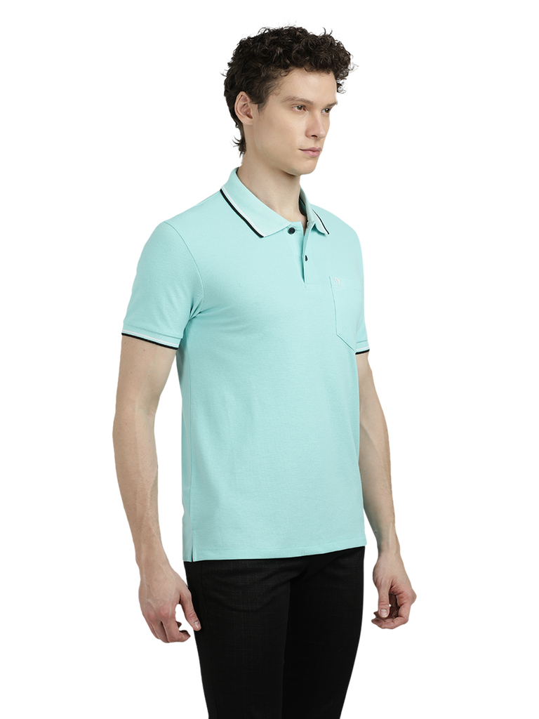 Model wearing Clarke Gable's Aqua Blue Solid Polo Collar T-Shirt in a casual setting