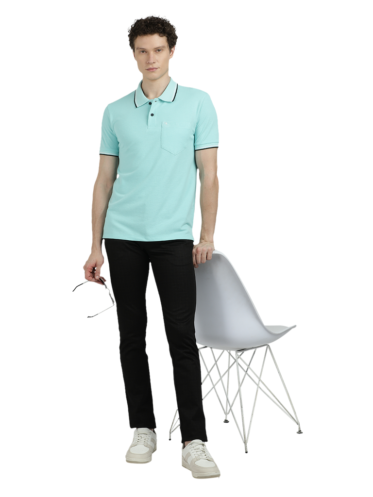 Model wearing Clarke Gable's Aqua Blue Solid Polo Collar T-Shirt in a casual setting