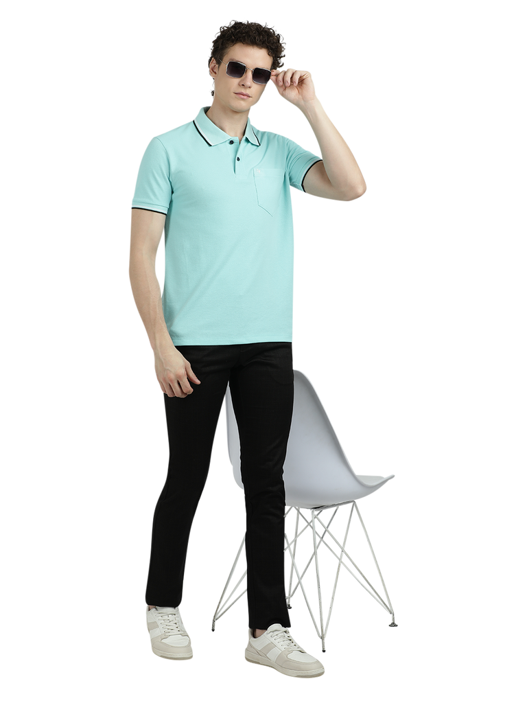 Model wearing Clarke Gable's Aqua Blue Solid Polo Collar T-Shirt in a casual setting