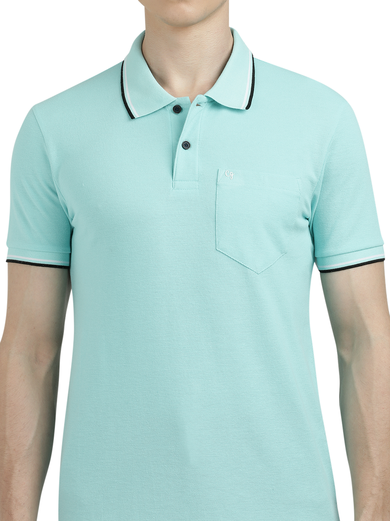 Model wearing Clarke Gable's Aqua Blue Solid Polo Collar T-Shirt in a casual setting