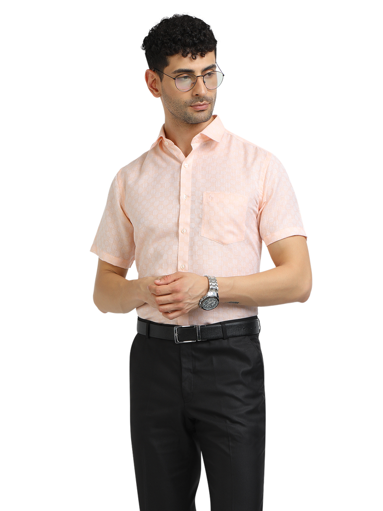 Model wearing Clarke Gable's Baby Pink Printed Formal Shirt in a casual setting