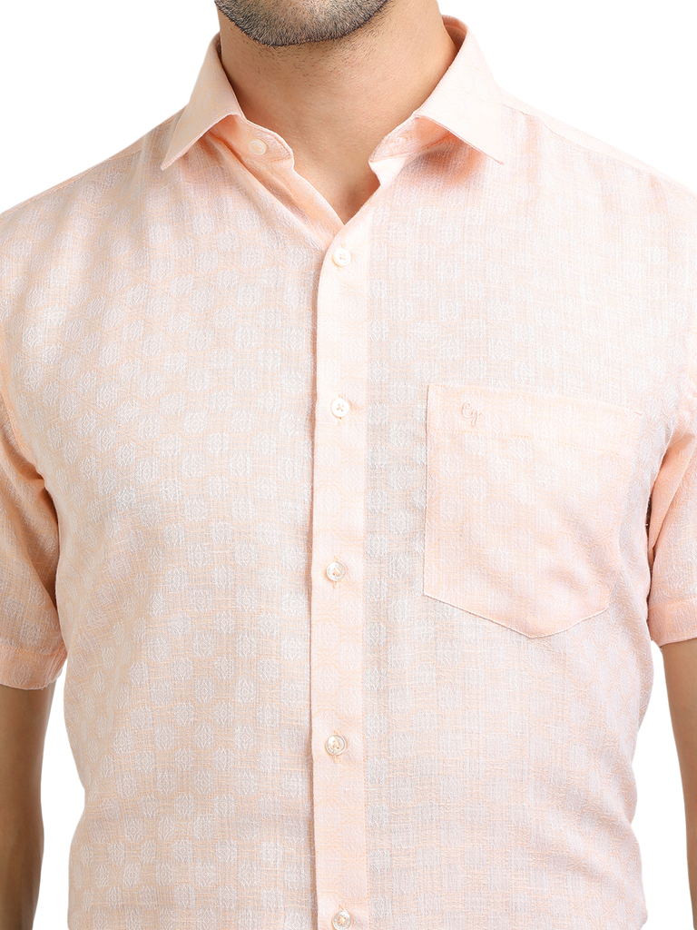 Model wearing Clarke Gable's Baby Pink Printed Formal Shirt in a casual setting