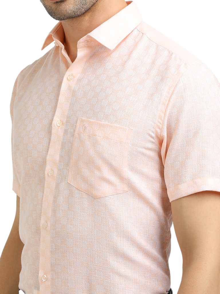 Model wearing Clarke Gable's Baby Pink Printed Formal Shirt in a casual setting