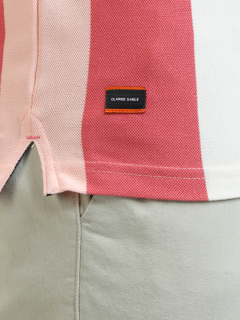 Model wearing Clarke Gable's Baby Pink With White Striped Polo Collar T-Shirt in a casual setting