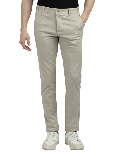 Model wearing Clarke Gable's Beige Custom Fit Trousers in a casual setting