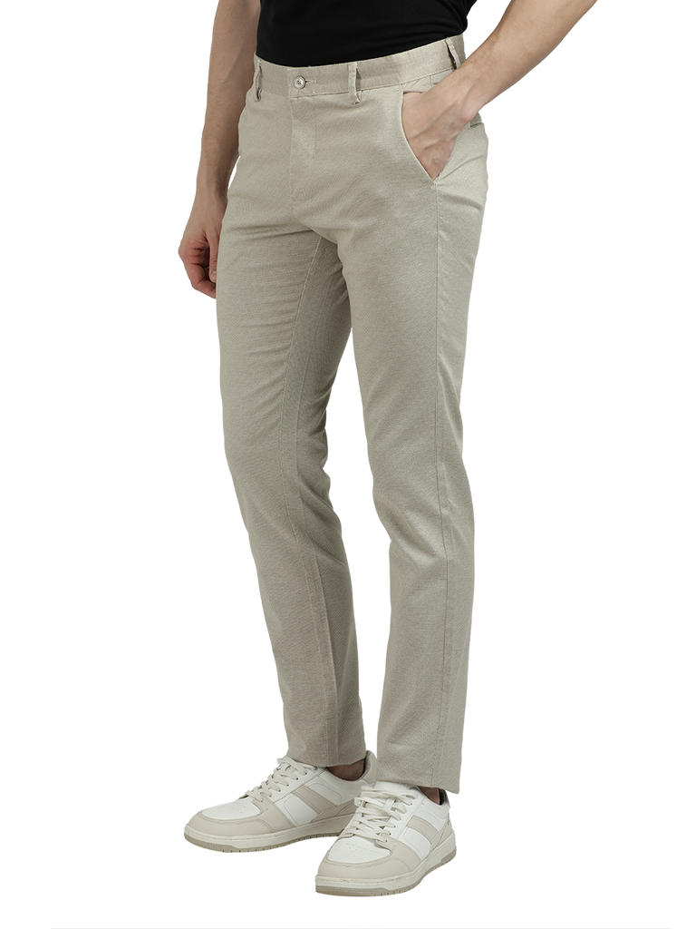 Model wearing Clarke Gable's Beige Custom Fit Trousers in a casual setting