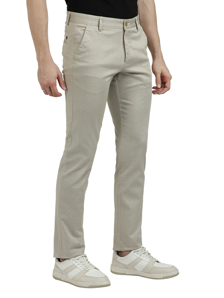 Model wearing Clarke Gable's Beige Custom Fit Trousers in a casual setting