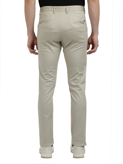 Model wearing Clarke Gable's Beige Custom Fit Trousers in a casual setting