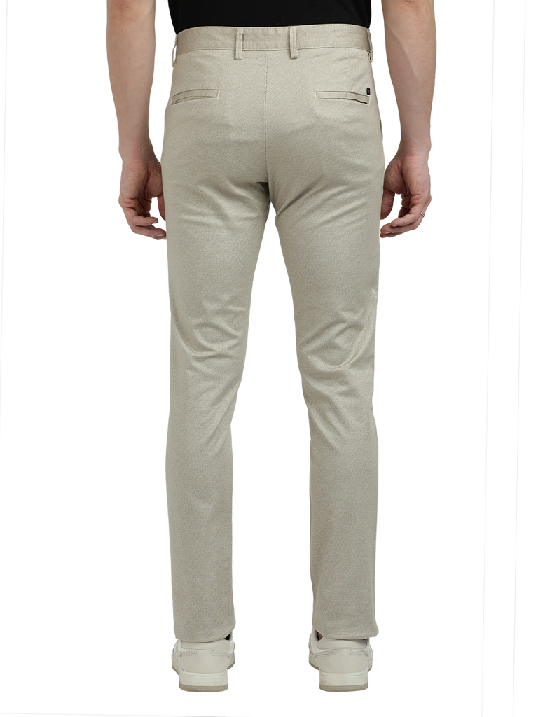 Model wearing Clarke Gable's Beige Custom Fit Trousers in a casual setting