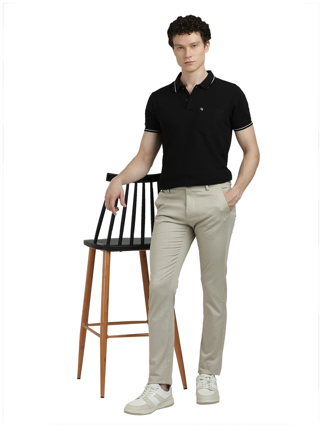 Model wearing Clarke Gable's Beige Custom Fit Trousers in a casual setting