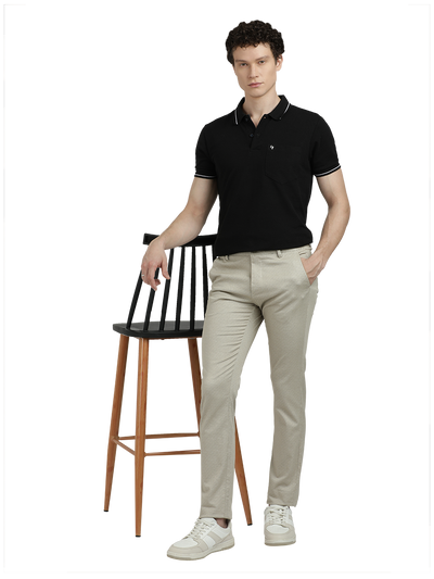 Model wearing Clarke Gable's Beige Custom Fit Trousers in a casual setting