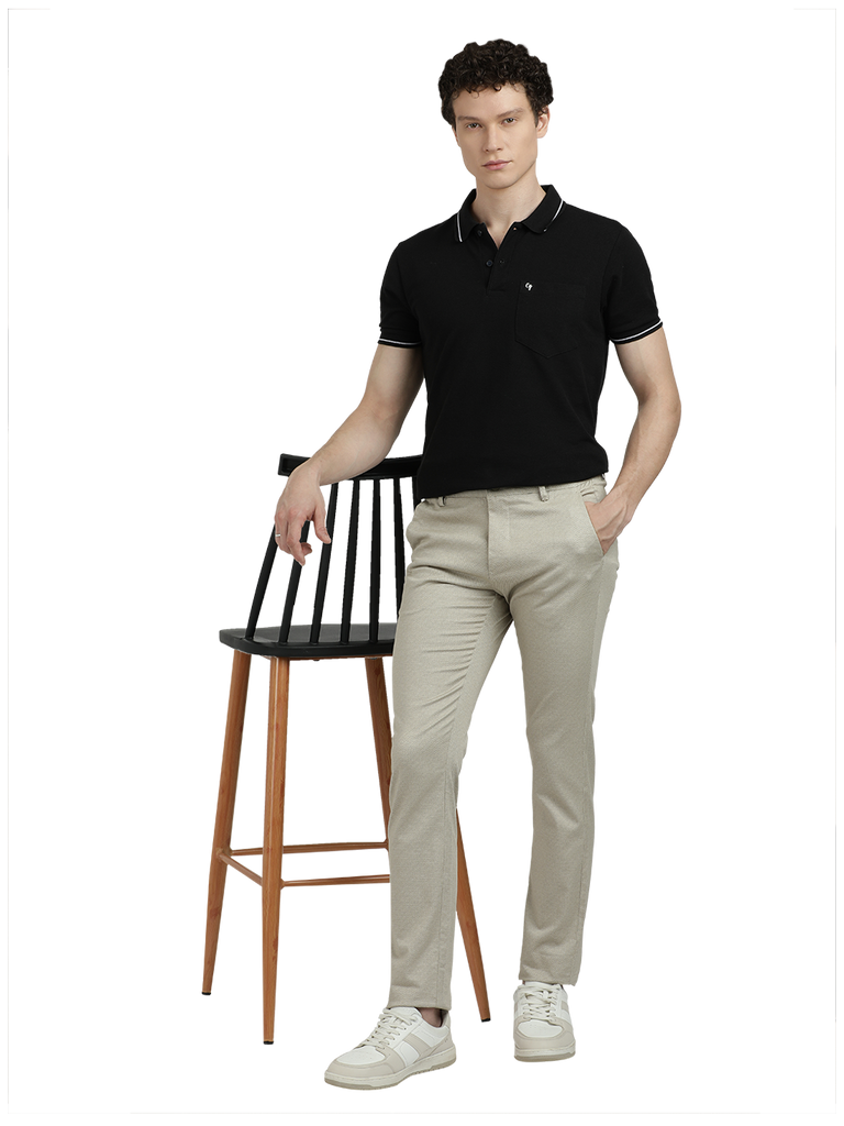 Model wearing Clarke Gable's Beige Custom Fit Trousers in a casual setting