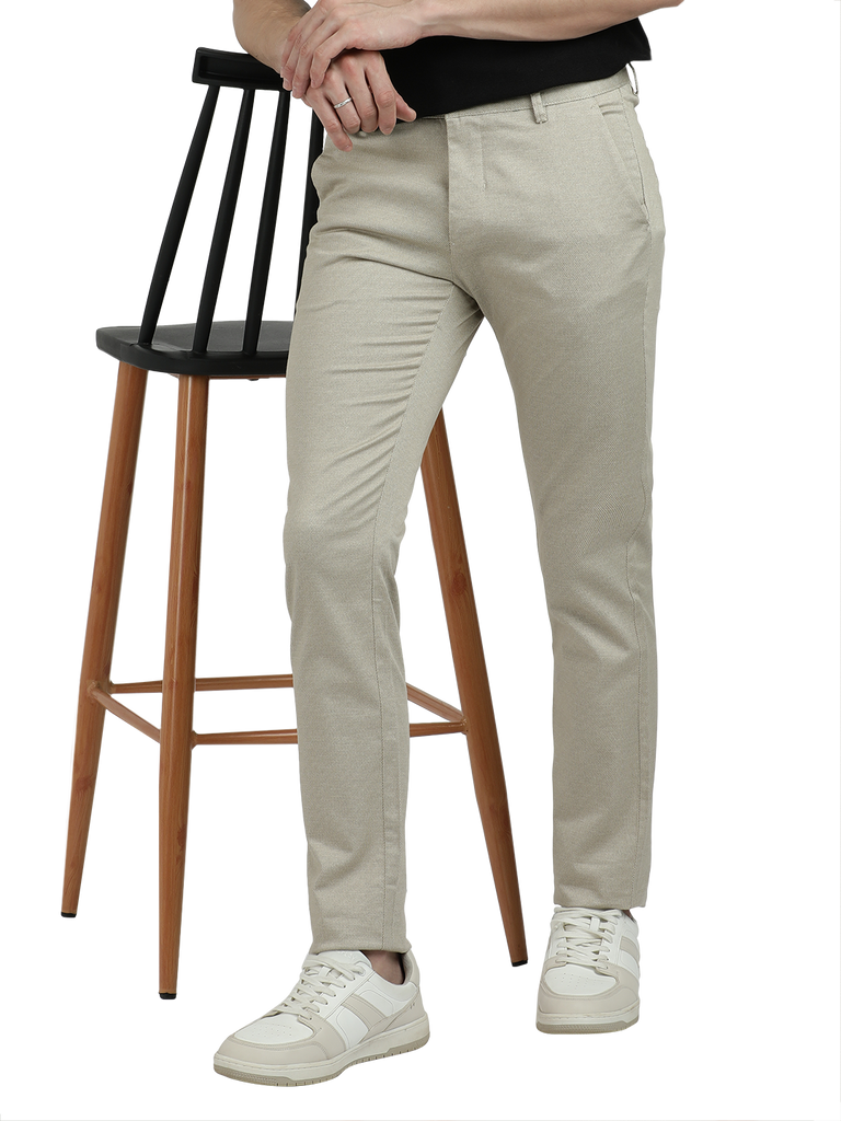 Model wearing Clarke Gable's Beige Custom Fit Trousers in a casual setting