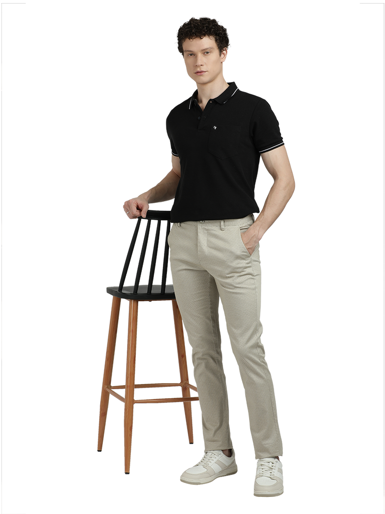 Model wearing Clarke Gable's Beige Custom Fit Trousers in a casual setting