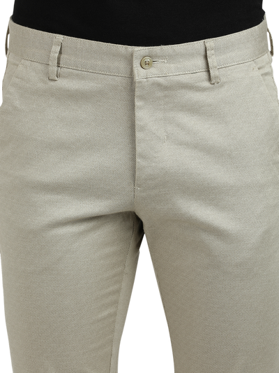 Model wearing Clarke Gable's Beige Custom Fit Trousers in a casual setting