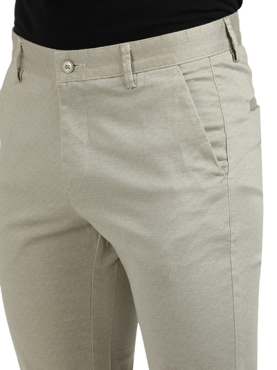 Model wearing Clarke Gable's Beige Custom Fit Trousers in a casual setting