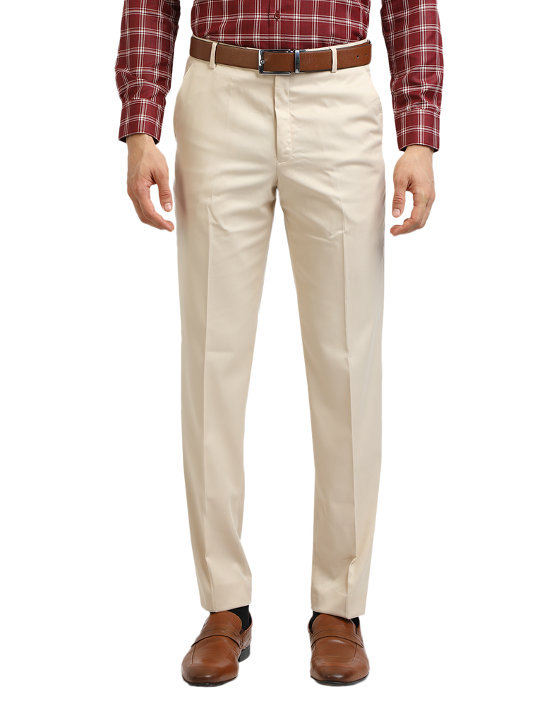 Model wearing Clarke Gable's Beige Sharp Fit Trousers in a casual setting