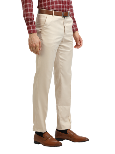 Model wearing Clarke Gable's Beige Sharp Fit Trousers in a casual setting