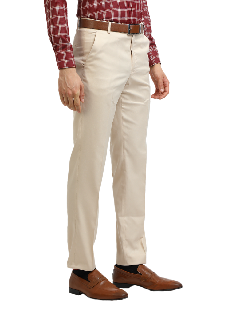 Model wearing Clarke Gable's Beige Sharp Fit Trousers in a casual setting