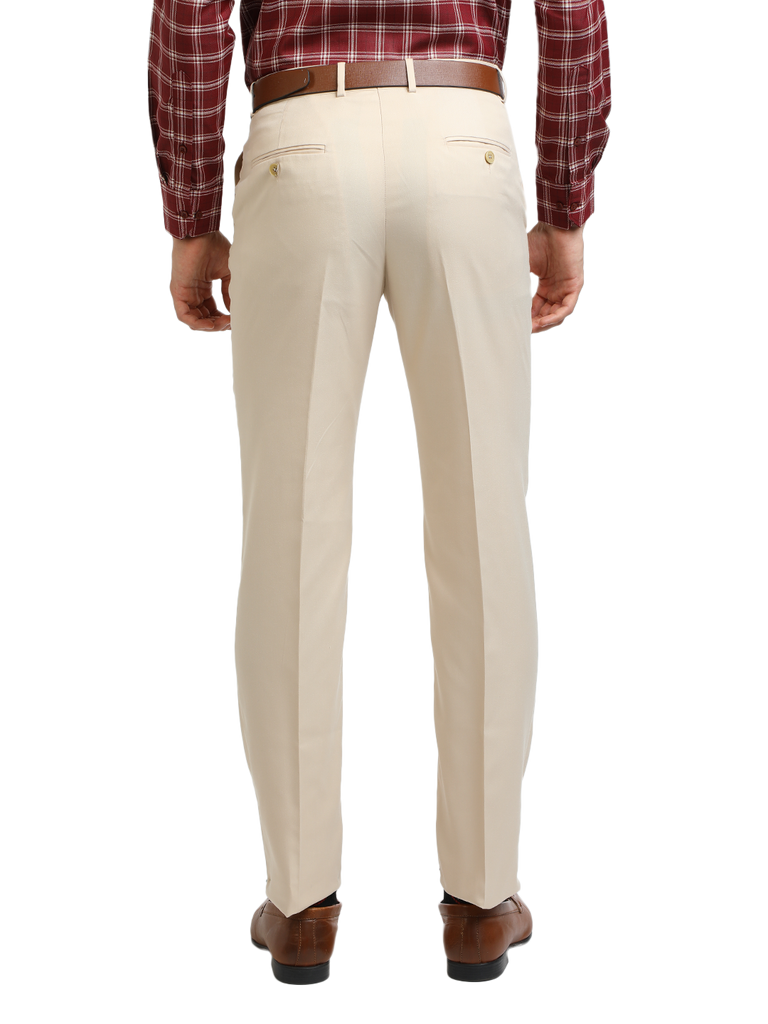 Model wearing Clarke Gable's Beige Sharp Fit Trousers in a casual setting