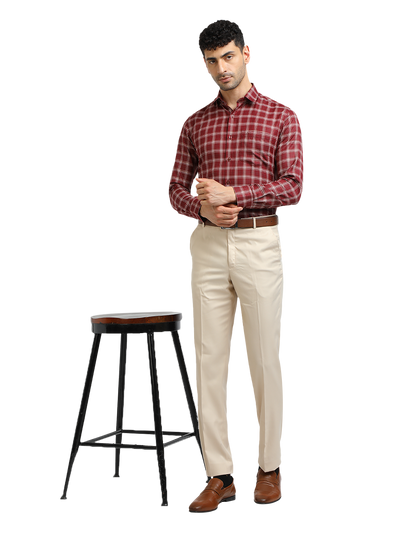 Model wearing Clarke Gable's Beige Sharp Fit Trousers in a casual setting