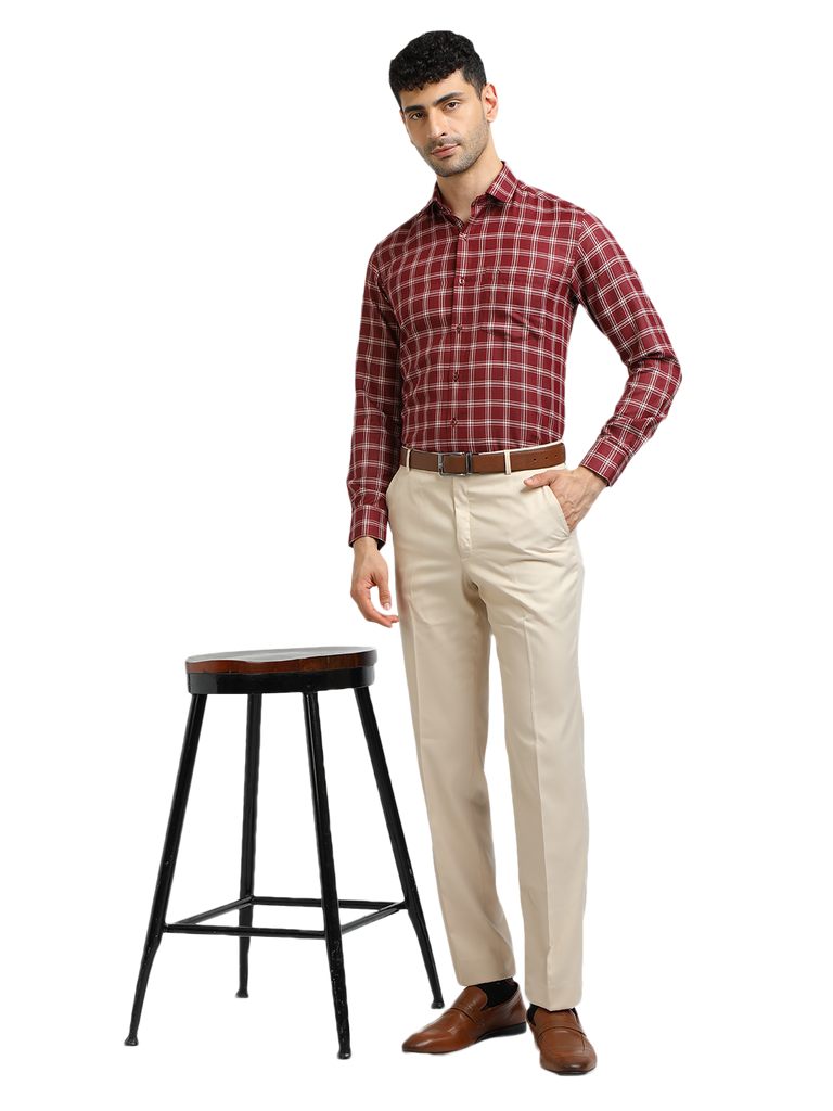 Model wearing Clarke Gable's Beige Sharp Fit Trousers in a casual setting