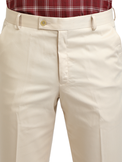 Model wearing Clarke Gable's Beige Sharp Fit Trousers in a casual setting