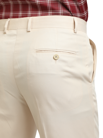 Model wearing Clarke Gable's Beige Sharp Fit Trousers in a casual setting
