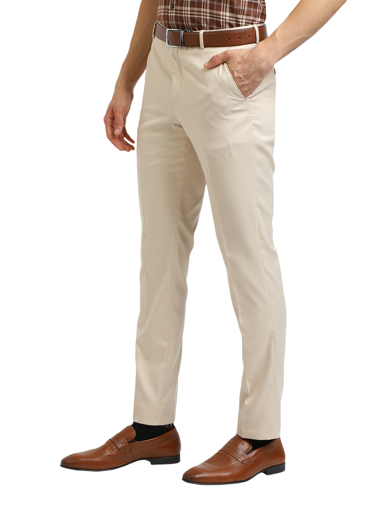 Model wearing Clarke Gable's Beige Smart Fit Trousers in a casual setting