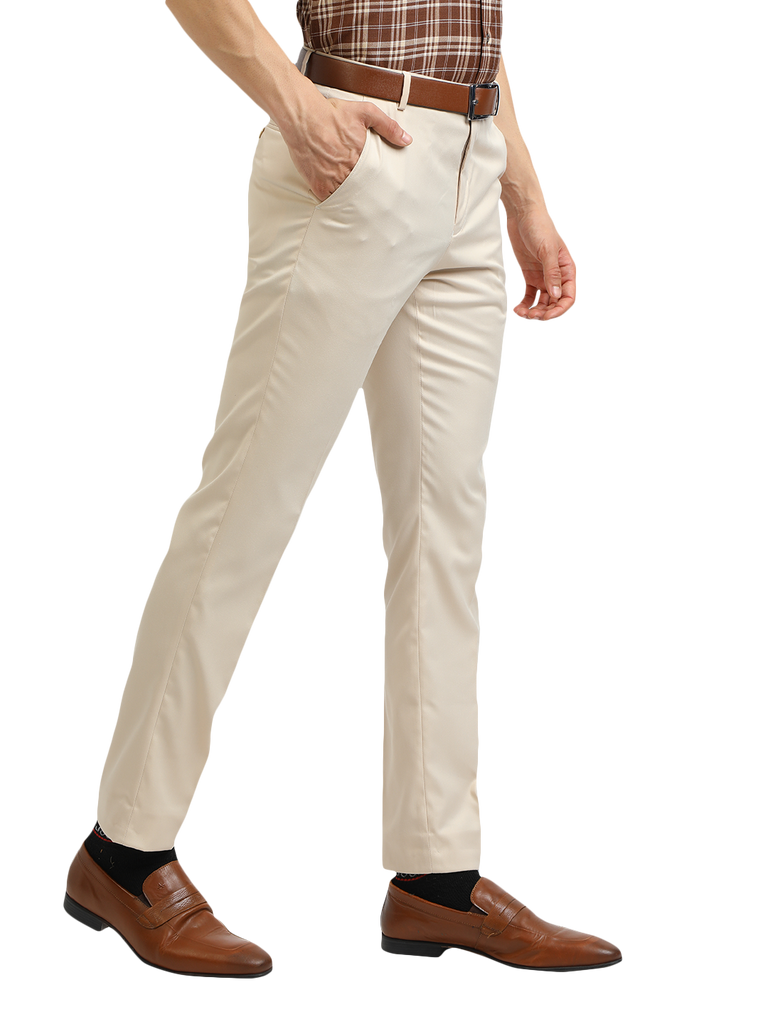 Model wearing Clarke Gable's Beige Smart Fit Trousers in a casual setting