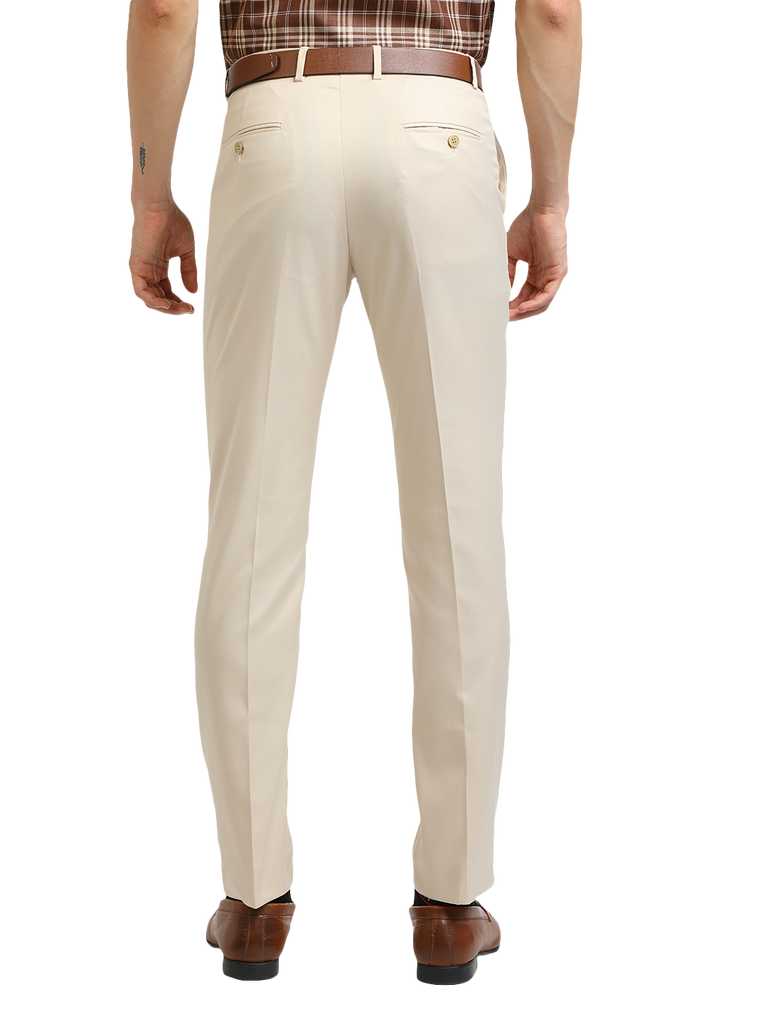 Model wearing Clarke Gable's Beige Smart Fit Trousers in a casual setting