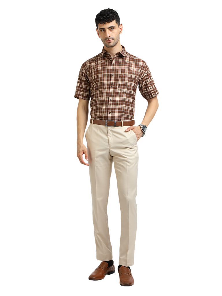 Model wearing Clarke Gable's Beige Smart Fit Trousers in a casual setting