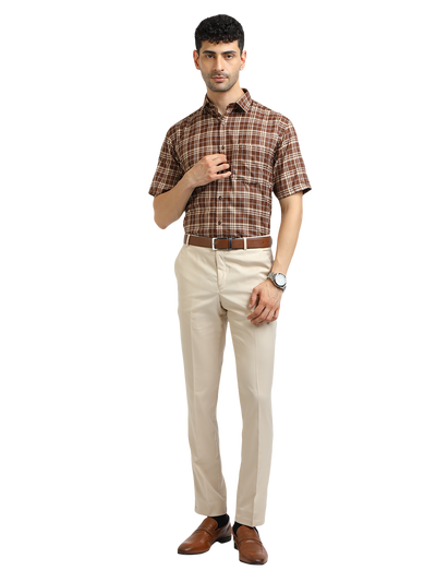 Model wearing Clarke Gable's Beige Smart Fit Trousers in a casual setting