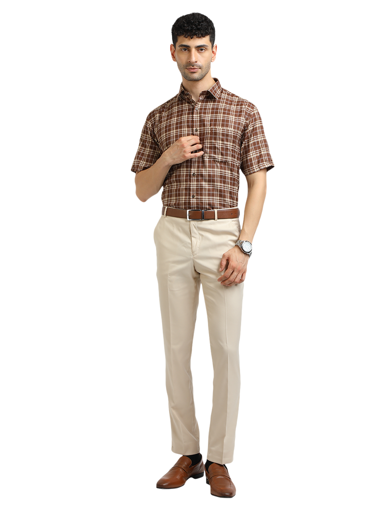 Model wearing Clarke Gable's Beige Smart Fit Trousers in a casual setting