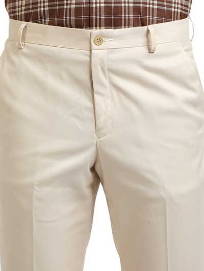 Model wearing Clarke Gable's Beige Smart Fit Trousers in a casual setting