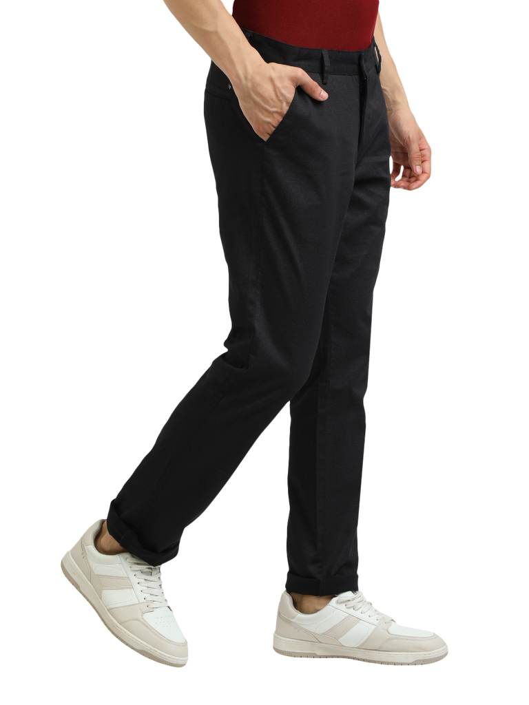 Model wearing Clarke Gable's Black Custom Fit Trousers in a casual setting