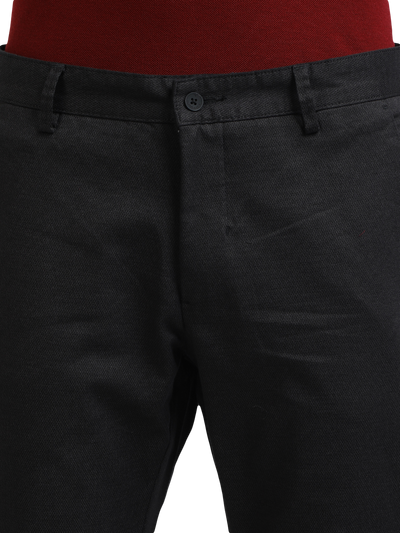 Model wearing Clarke Gable's Black Custom Fit Trousers in a casual setting