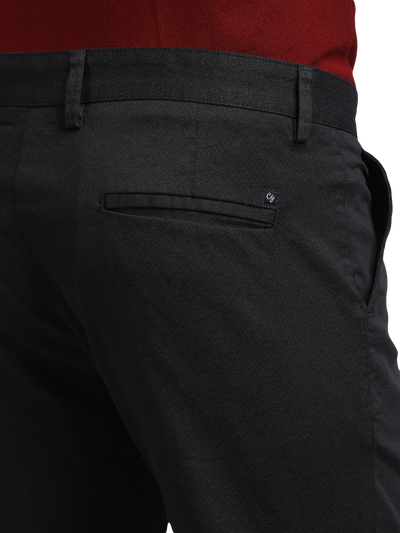 Model wearing Clarke Gable's Black Custom Fit Trousers in a casual setting