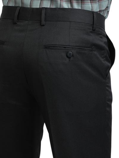 Model wearing Clarke Gable's Black Smart Fit Trousers in a casual setting