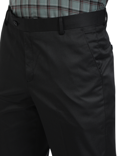 Model wearing Clarke Gable's Black Smart Fit Trousers in a casual setting