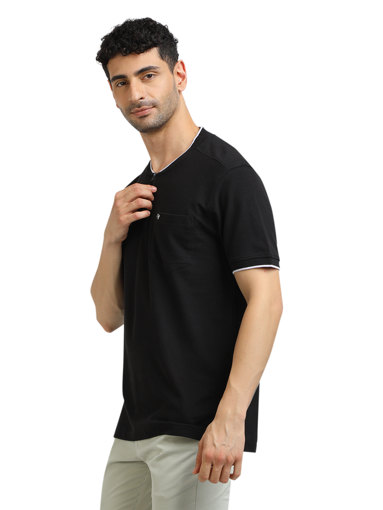 Model wearing Clarke Gable's Black Solid Henley Neck T-Shirt in a casual setting