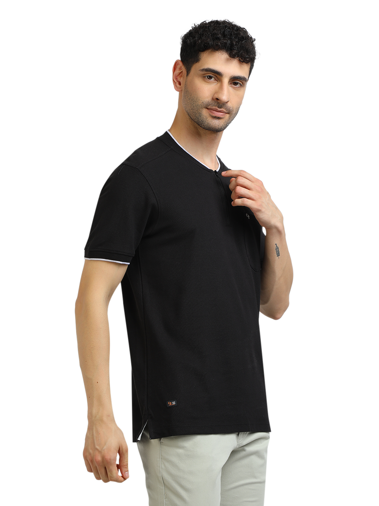 Model wearing Clarke Gable's Black Solid Henley Neck T-Shirt in a casual setting